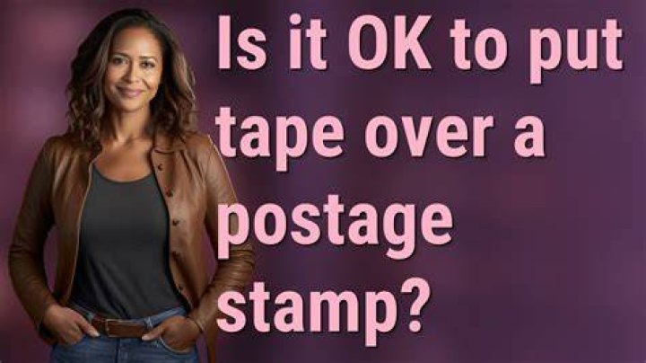 Is it OK to put tape over a postage stamp?
